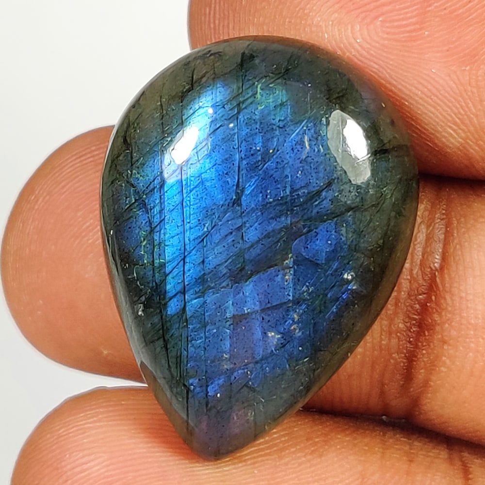 28.46 Ct Natural Blue Shaded Labradorite Pear Cab: Weight - 28.46 Ct / Size - 26.00 x 19.00 x 7.60 mm / Shape - Excellent Pear Cabochon / Clarity - Opaque / Origin - Africa / Treatment - None