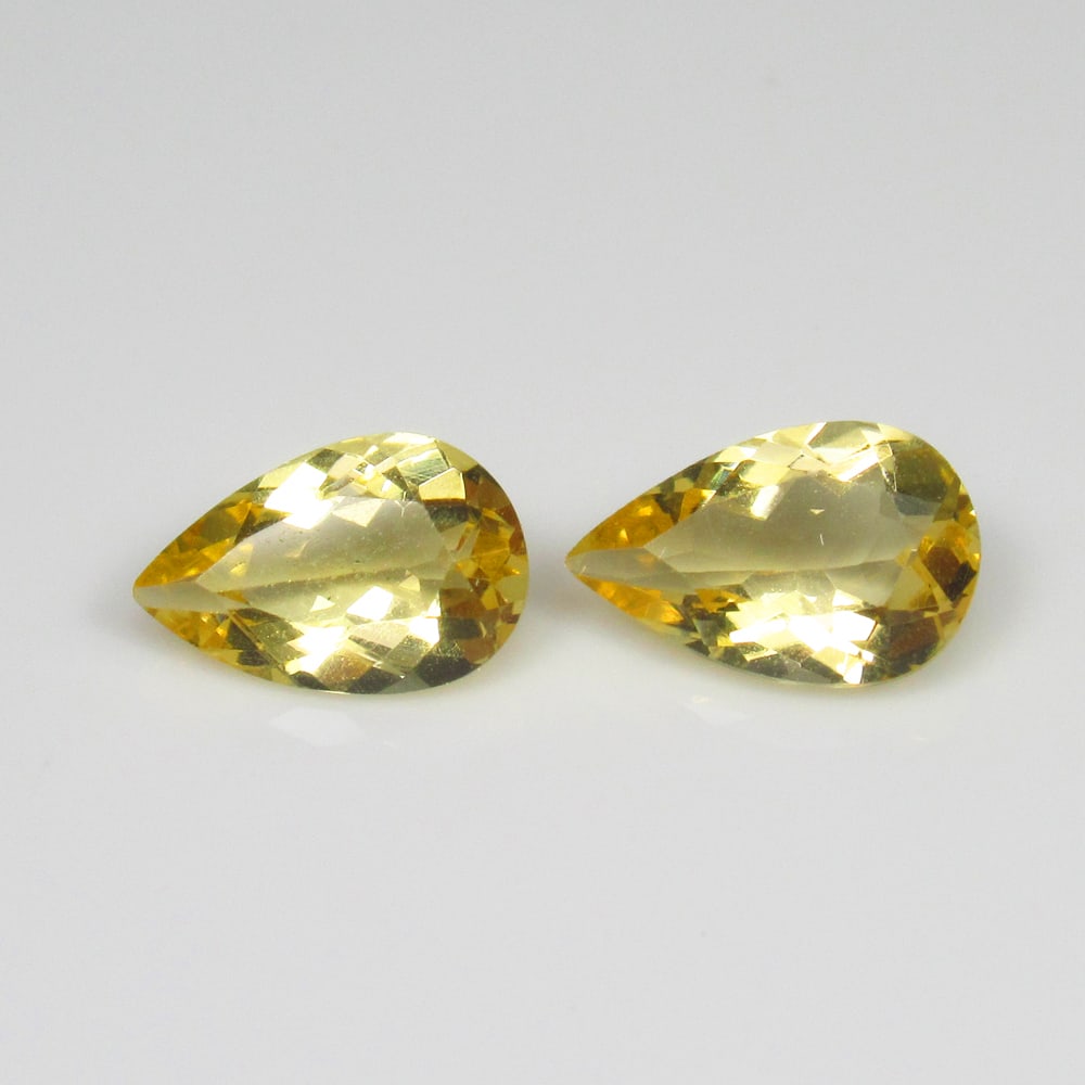 2.04 Ct Natural Yellow Citrine Pear Cut Pair: Weight - 2.04 Ct / Size - 9.00 x 6.00 x 3.80 mm / 2 Pc's / Shape - Pear Cut / Color - Yellow / Clarity - VVS / Origin - Brazil / Treatment - Heated