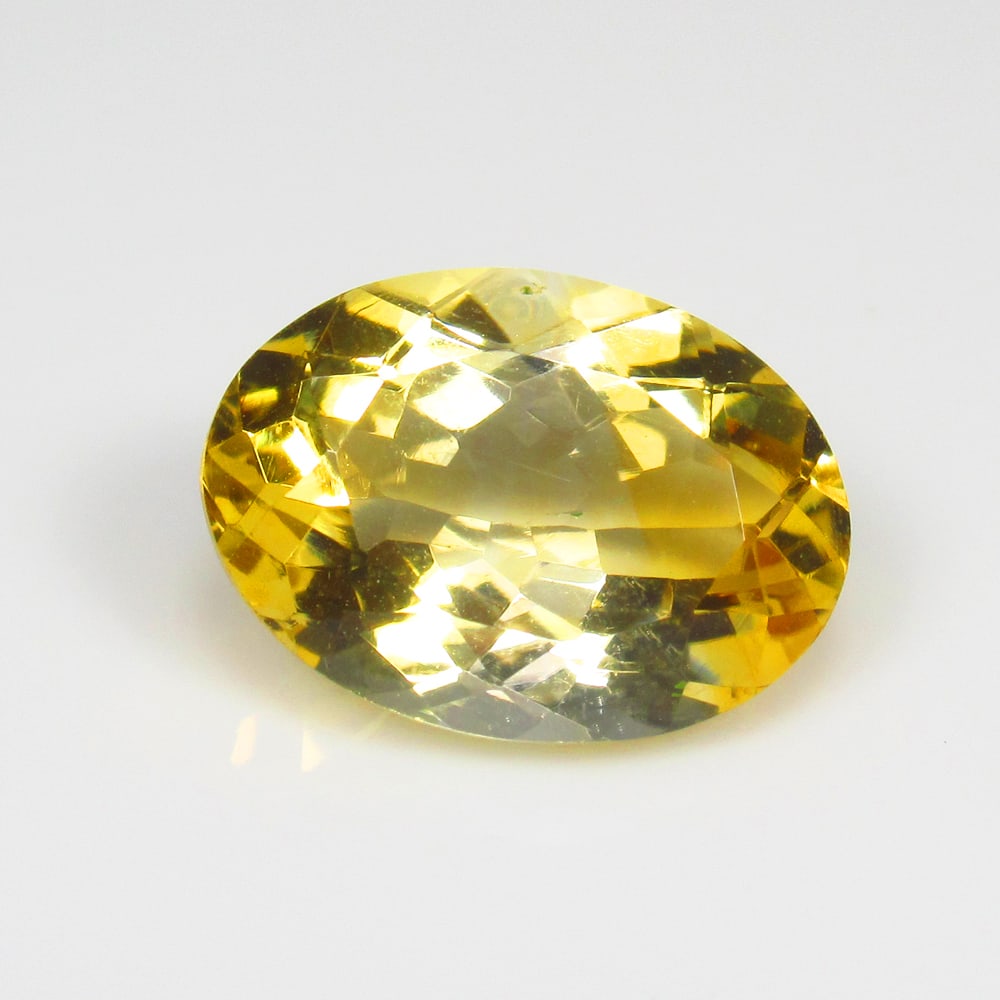 5.24 Ct Natural Yellow Citrine Oval Cut: Weight - 5.24 Ct / Size - 14.30 x 10.30 x 6.40 mm / Shape - Oval Cut / Color - Yellow / Clarity - VVS / Origin - Brazil / Treatment - Heated