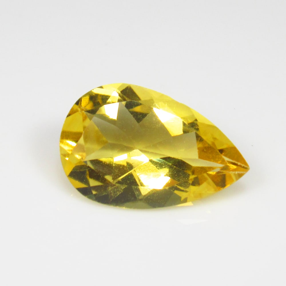 4.03 Ct Natural Yellow Citrine Pear Cut: Weight - 4.03 Ct / Size - 15.00 x 9.70 x 5.60 mm / Shape - Pear Cut / Color - Yellow / Clarity - VVS / Origin - Brazil / Treatment - Heated