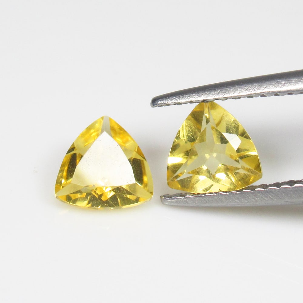 1.18 Ct Natural Yellow Citrine Trillion Cut Pair: Weight - 1.18 Ct / Size - 6.20 x 6.10 x 3.20 mm / 2 Pc's / Shape - Trillion Cut / Color - Yellow / Clarity - VVS / Origin - Brazil / Treatment - Heated
