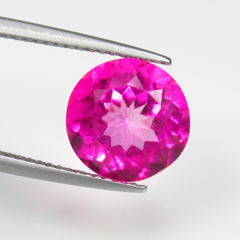 5.02 Ct Natural Pink Topaz Round Cut: Weight - 5.02 Ct / Size - 10.10 x 10.10 x 6.60 mm / Shape - Round Cut / Color - Pink / Clarity - VVS / Origin - Brazil / Treatment - Color Coated