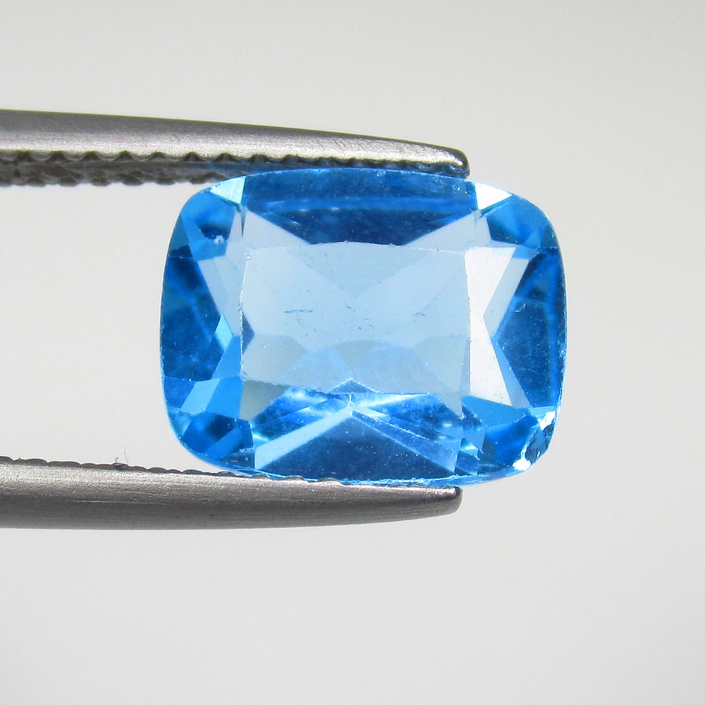 3.52 Ct Natural Blue Topaz Cushion Cut: Weight - 3.52 Ct / Size - 10.30 x 8.20 x 4.80 mm / Shape - Cushion Cut / Color - Blue / Clarity - VVS / Origin - Brazil / Treatment - Irradiated