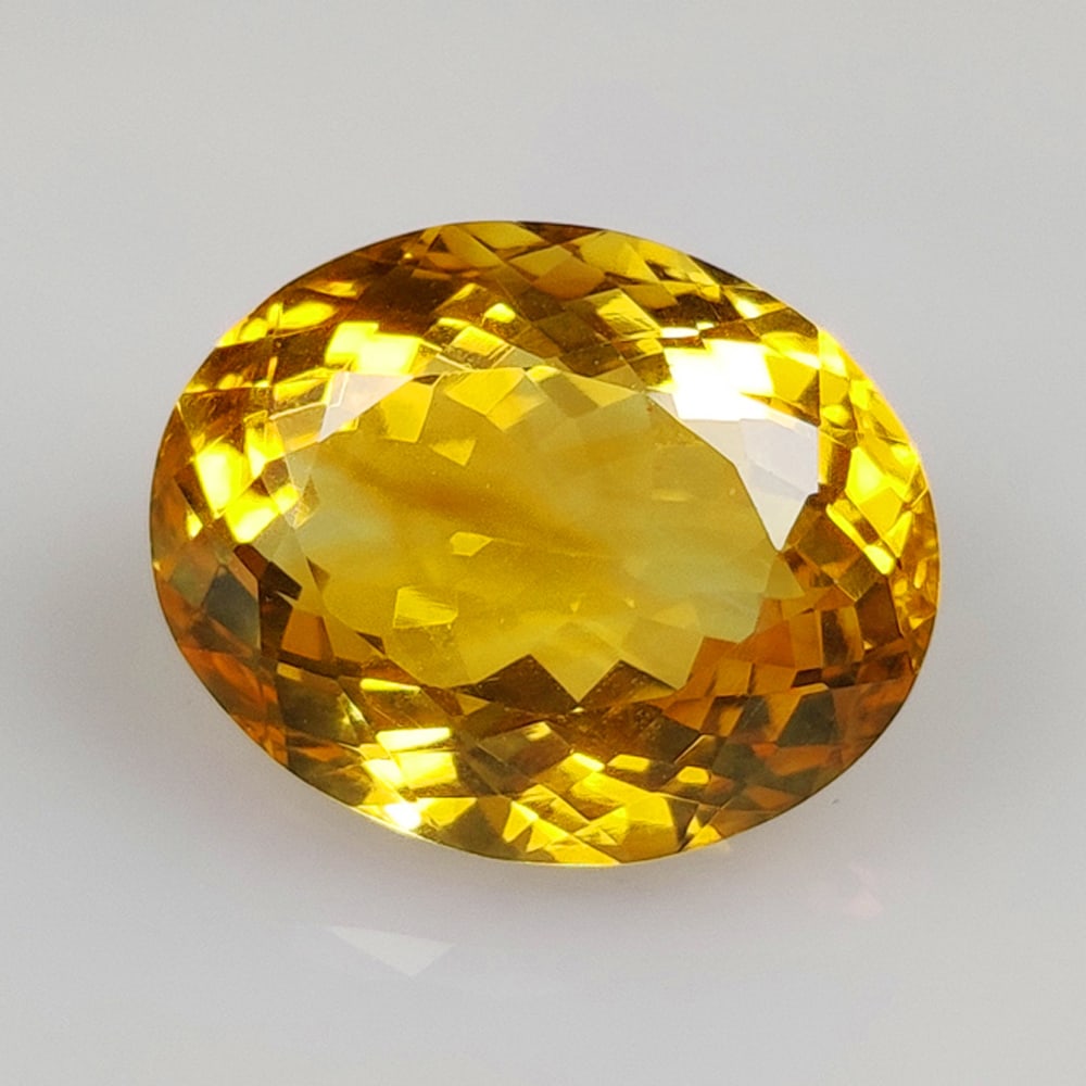 12.42 Ct Natural Citrine Oval Cut: Weight - 12.42 Ct / Size - 17.30 x 13.90 x 9.00 mm / Shape - Oval Cut / Color - Yellow / Clarity - VVS / Origin - Brazil / Treatment - Heated