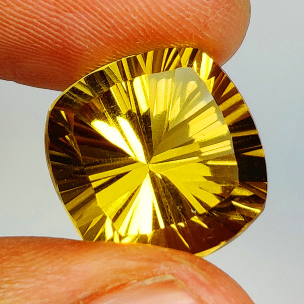 12.43 Ct Natural Yellow Citrine Cushion Concave Cut: Weight - 12.43 Ct / Size - 14.60 x 14.50 x 10.60 mm / Shape - Cushion Cut / Color - Yellow / Clarity - VVS / Origin - Brazil / Treatment - None