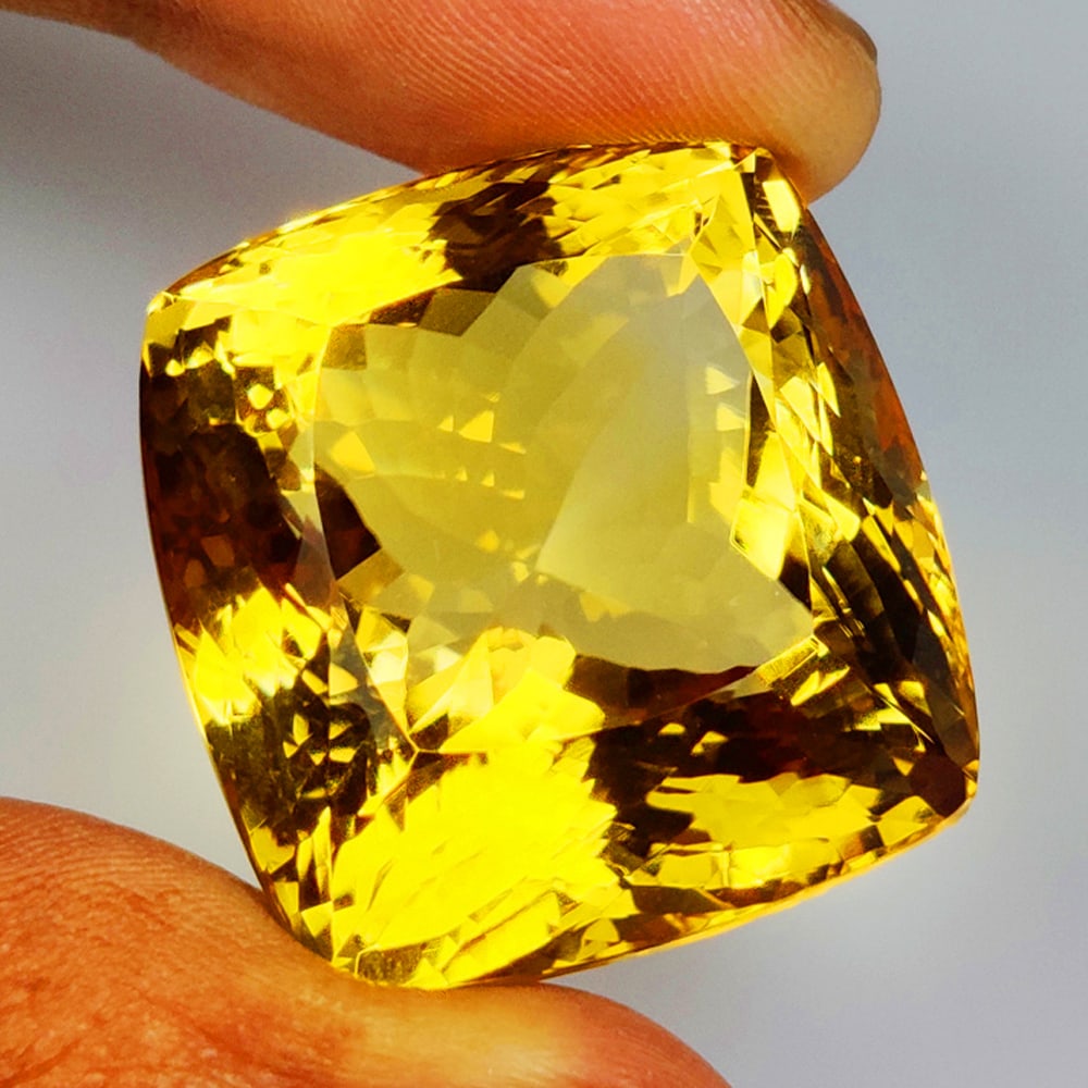 120.00 Ct Natural Yellow Citrine Cushion Cut: Weight - 120.00 Ct / Size -29.00 x 23.00 x 21.00 mm / Shape - Cushion Cut / Color - Yellow / Clarity - VVS / Origin - Brazil / Treatment - Heated