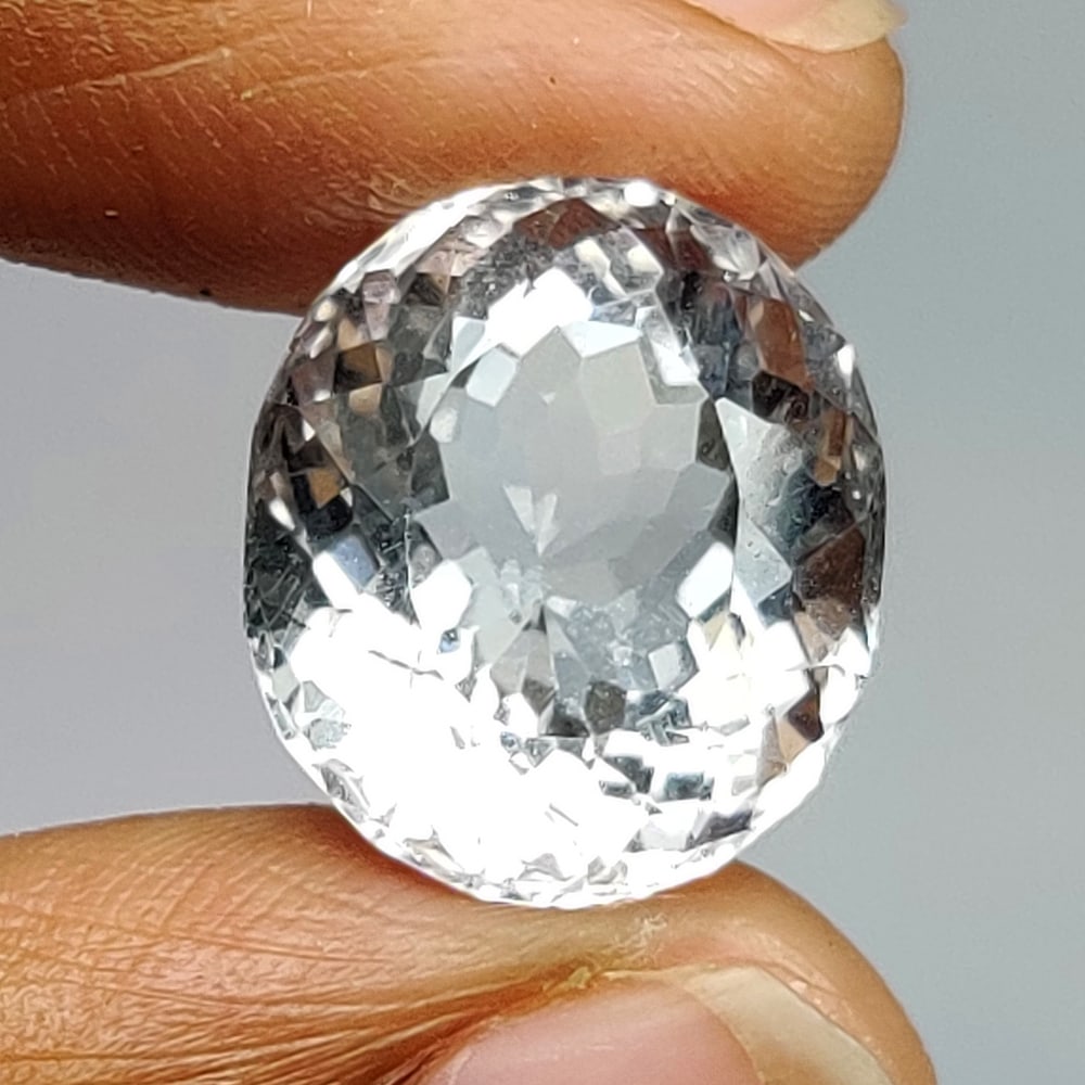 9.08 Ct Natural Colorless Quartz Oval Cut: Weight - 9.08 Ct / Size - 14.20 x 12.30 x 9.10 mm / Shape - Oval Cut / Clarity - Opaque / Origin - Brazil / Treatment - None