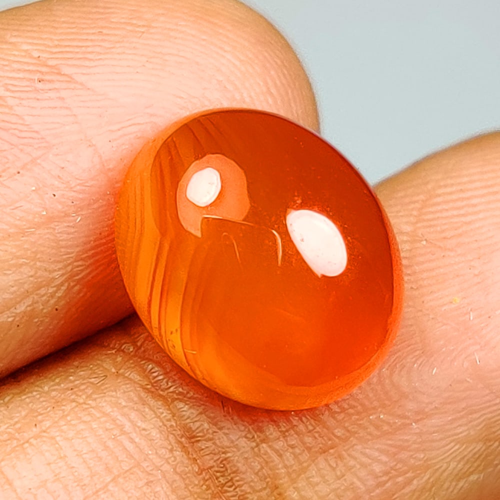 3.81 Ct Natural Orange Carnelian Oval Cab: Weight - 3.81 Ct / Dimensions - 11.00 x 9.10 x 5.30 mm / Shape & Cut - Oval Cab / Transparency - Semi - Opaque / Origin - Brazil