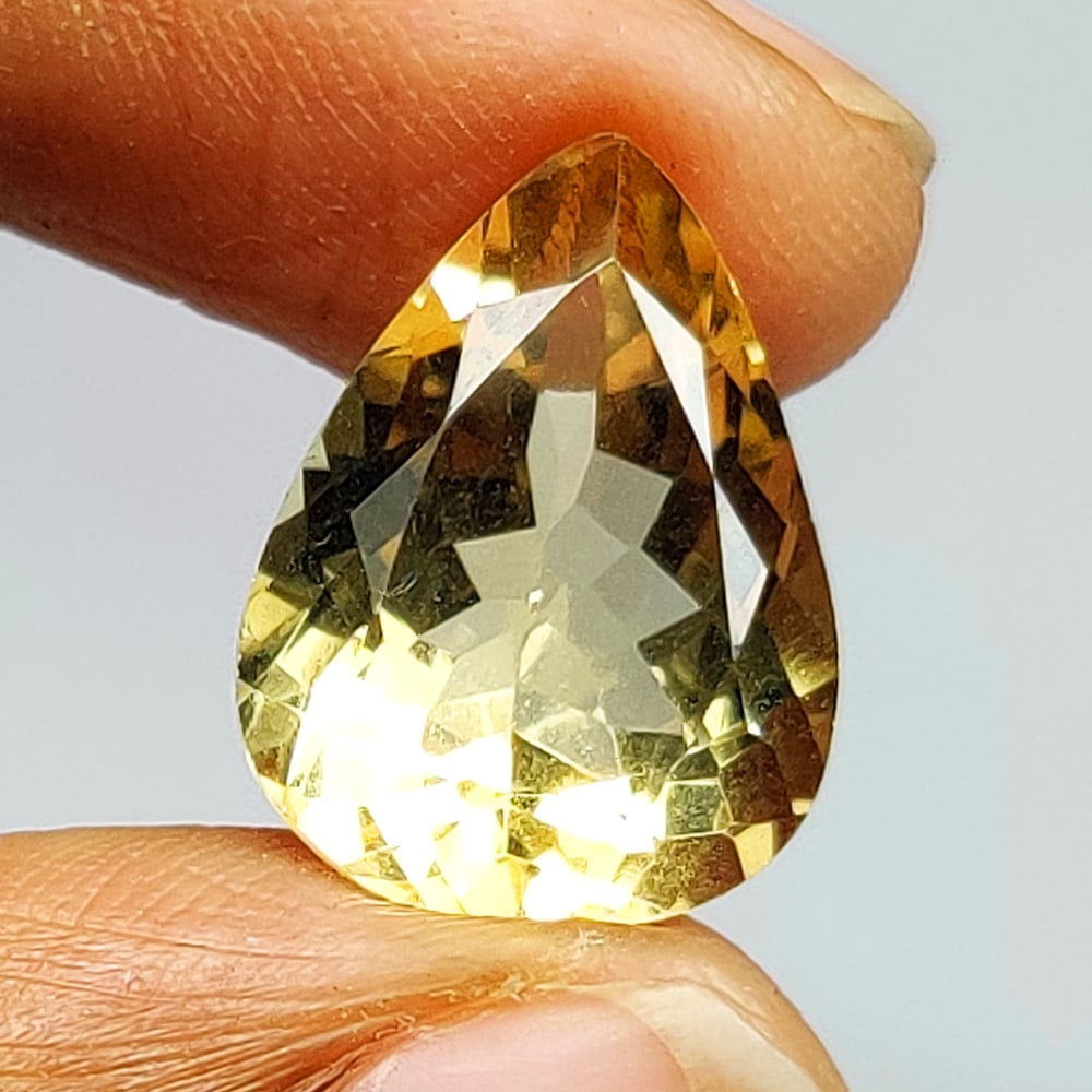 6.37 Ct Natural Yellow Citrine Pear Cut: Weight - 6.37 Ct / Dimensions - 14.90 x 11.20 x 7.50 mm / Shape - Pear Cut / Color - Yellow / Clarity - VVS / Origin - Brazil / Treatment - Heated