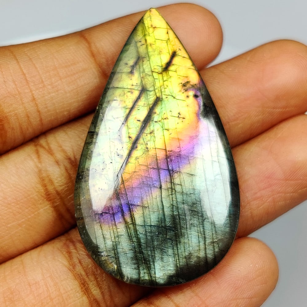 39.43 Ct Natural Blue Shaded Labradorite Pear Cab: Weight - 39.43 Ct / Size - 41.00 x 24.00 x 5.50 mm / Shape - Excellent Pear Cab / Clarity - Opaque / Origin - Africa / Treatment - None