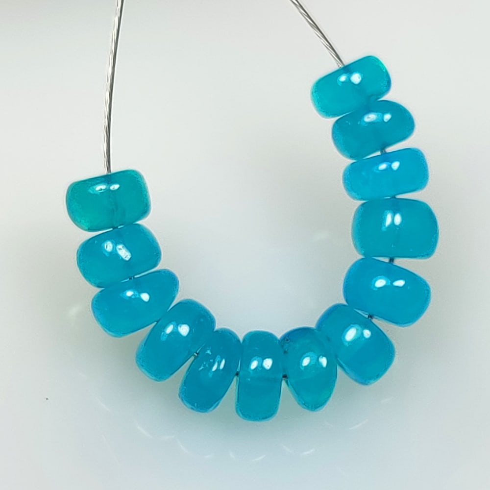 3.93 Ct Natural Blue Fire Opal Round Beads: Weight - 3.93 Ct / Size - 4.40 - 5.00 mm / 13 pc's / Shape - Round Beads / Color - Blue / Clarity - Translucent / Origin - Ethiopia / Treatment - Heated