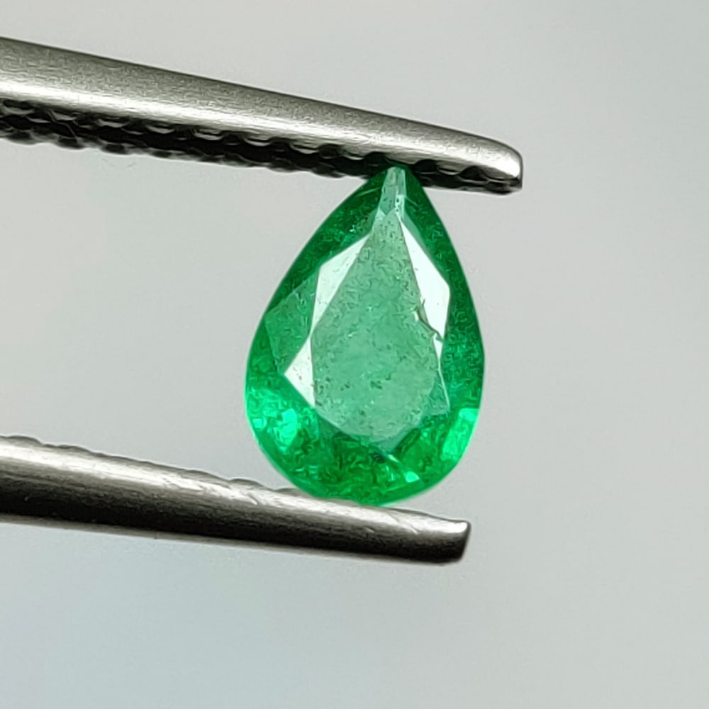 0.33 Ct Natural Zambian Green Emerald Pear Cut: Weight - 0.33 Ct / Size - 6.20 x 4.20 x 2.20 mm / Shape - Pear Cut / Color - Green / Clarity - SI / Origin - Zambia / Treatment - Natural Emeralds are commonly enhanced by oil