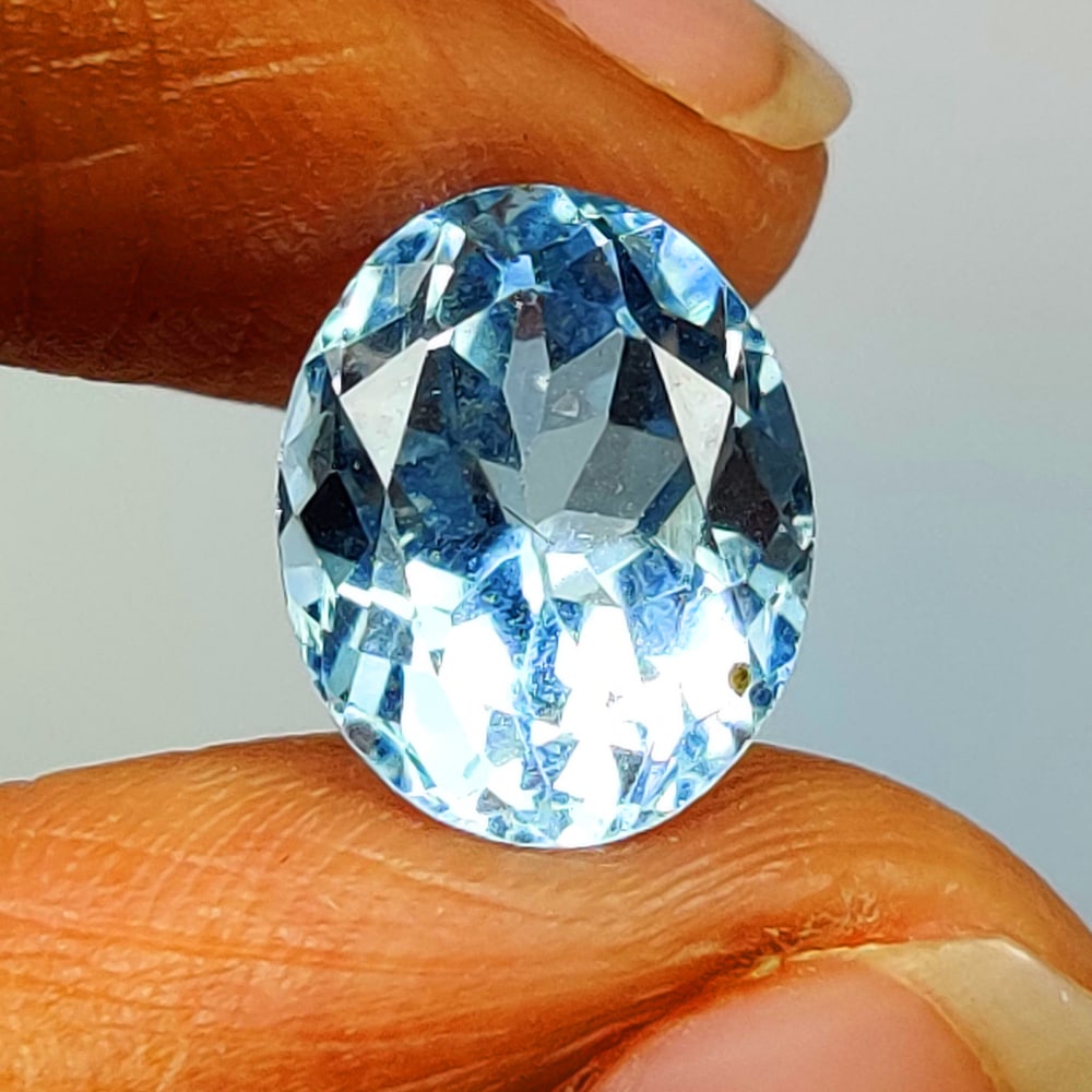 3.97 Ct Natural Blue Topaz Oval Cut: Weight - 3.97 Ct / Size - 10.30 x 8.30 x 6.30 mm / Shape - Oval Cut / Color - Blue / Clarity - VVS / Origin - Brazil / Treatment - Irradiated