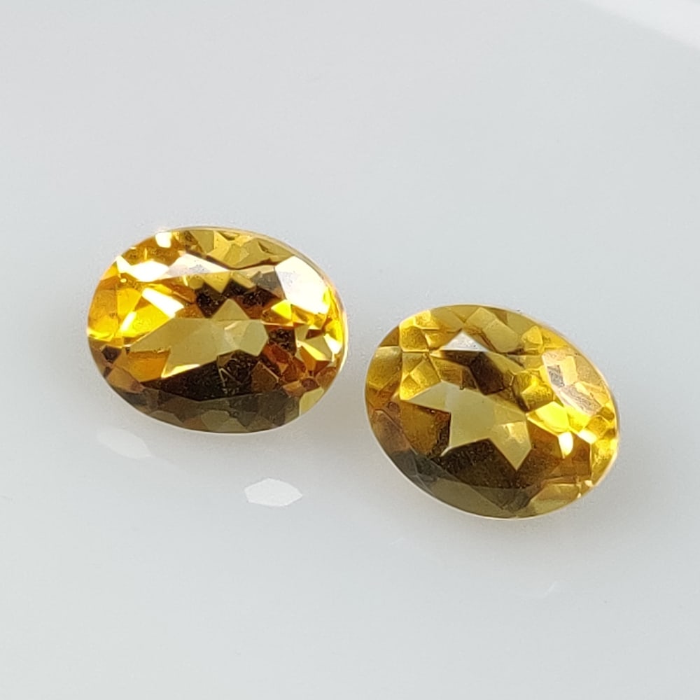 6.12 Ct Natural Yellow Citrine Oval Cut Pair: Weight - 6.12 Ct / Size - 10.00 x 7.90 x 6.40 mm / 2 Pc's / Shape - Oval Cut / Color - Yellow / Clarity - VVS / Origin - Brazil / Treatment - Heated