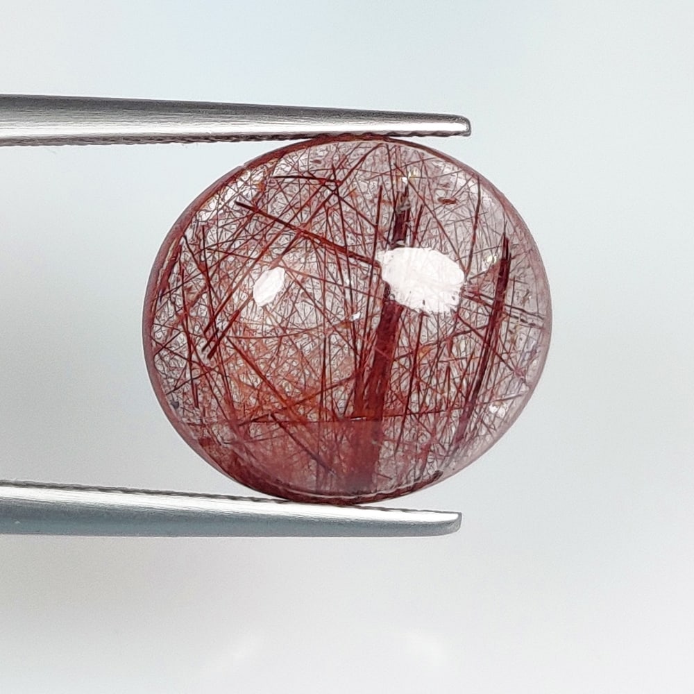 10.57 Ct Natural Brown Hair Rutile Quartz Oval Cab: Weight - 10.57 Ct / Dimensions - 15.00 x 13.50 x 7.20 mm / Shape & Cut - Oval cab / Transparency - Transaprent / Origin - Norway / Comments - None