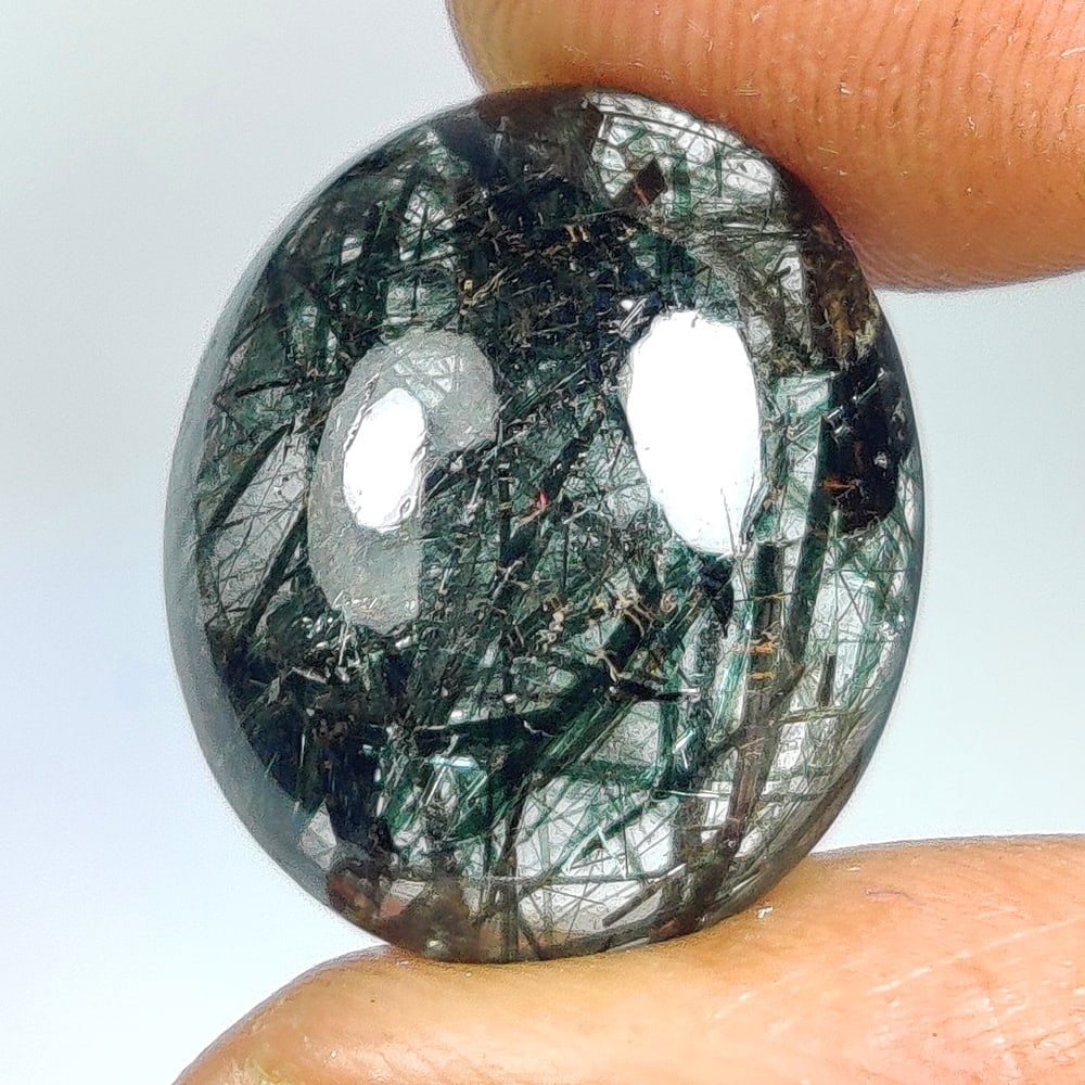11.48 Ct Natural Black Hair Rutile Quartz Oval Cab: Weight - 11.48 Ct / Dimensions - 16.20 x 13.70 x 7.30 mm / Shape & Cut - Oval Cab / Transparency - Transparent / Origin - Norway / Comments - None