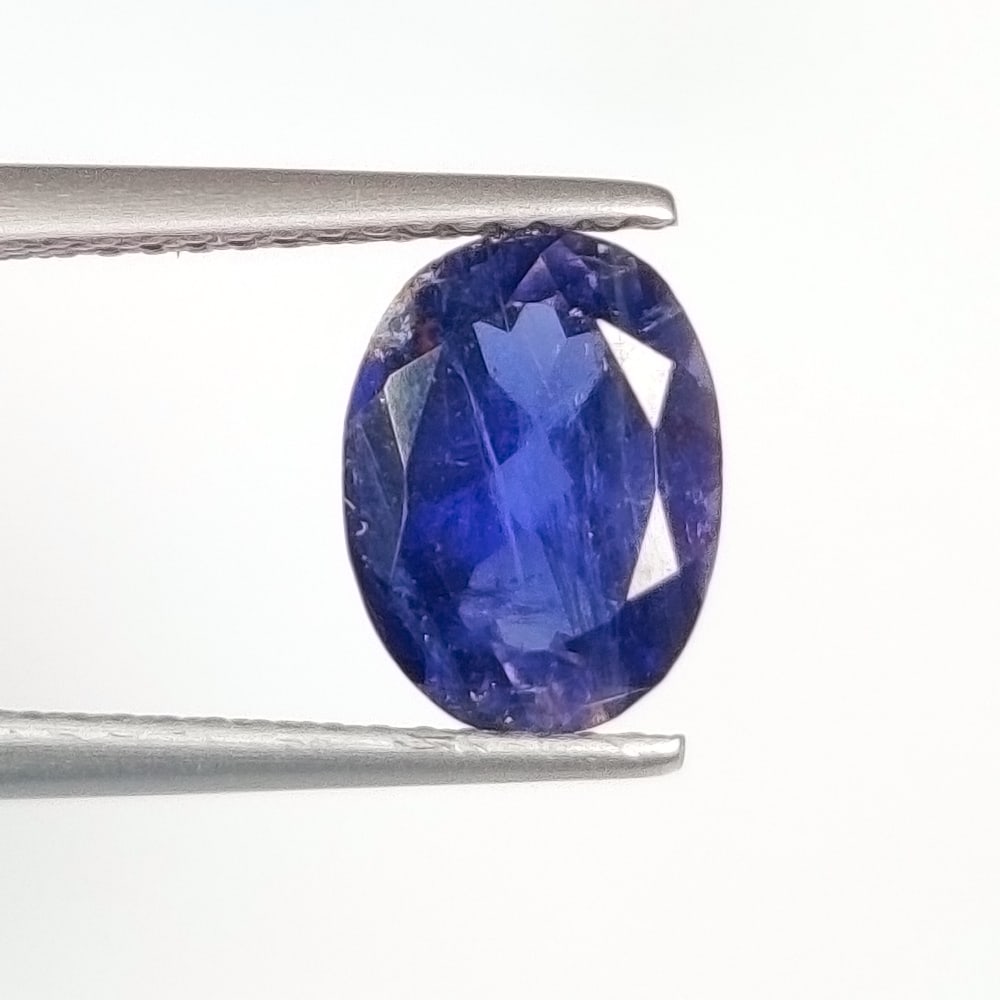 1.81 Ct Natural Deep Violet Iolite Oval Cut: Weight - 1.81 Ct / Size - 9.40 x 7.00 x 4.90 mm / Shape - Oval Cut / Color - Deep Violet / Clarity - VVS / Origin - Nigeria / Treatment - None