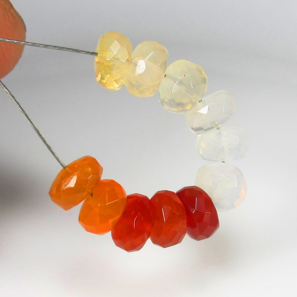 7.55 Ct Natural Fire Opal Round Beads: Weight - 7.55 Ct / Dimensions - 5.60 - 5.80 mm / 11 Pc's / Shape - Round Beads / Clarity - Opaque / Origin - Brazil / Treatment - None