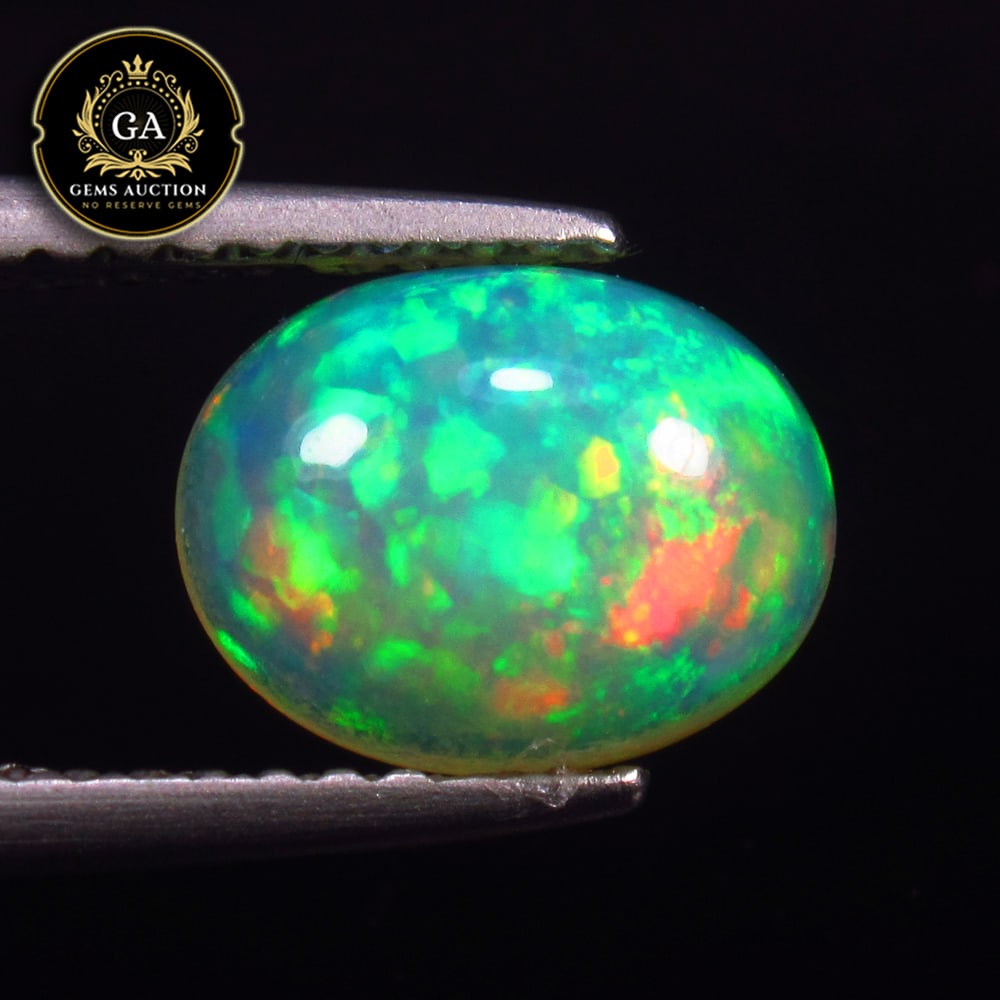 1.11 Ct IGI Certified Natural Multicolor Top Fire Opal Oval Cab: Weight - 1.11 Ct / Size - 8.90 x 6.93 x 3.67 mm / Shape - Oval Cab / Color - Multicolor / Clarity - Transparent / Origin - Ethiopia / Treatment - None / Certificate No : 371907255 / Link - https://www