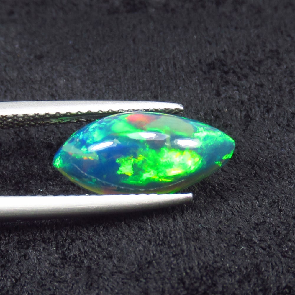 2.23 Ct Natural Black Flashing Fire Opal Marquise Cab: Weight - 2.23 Ct / Size - 15.00 x 17.30 x 4.90 mm / Shape - Marquise Cab / Color - Black / Clarity - Translucent / Origin - Ethiopia / Treatment - Color Smoked
