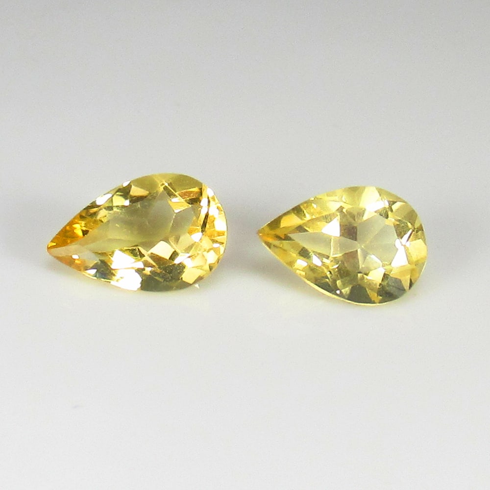 2.30 Ct Natural Yellow Citrine Pear Cut Pair: Weight - 2.30 Ct / Dimensions - 9.00 x 6.30 x 4.50 mm / 2 Pc's / Shape & Cut - Pear Cut / Color - Yellow / Transparency - VVS / Origin - Brazil / Comments - Heated