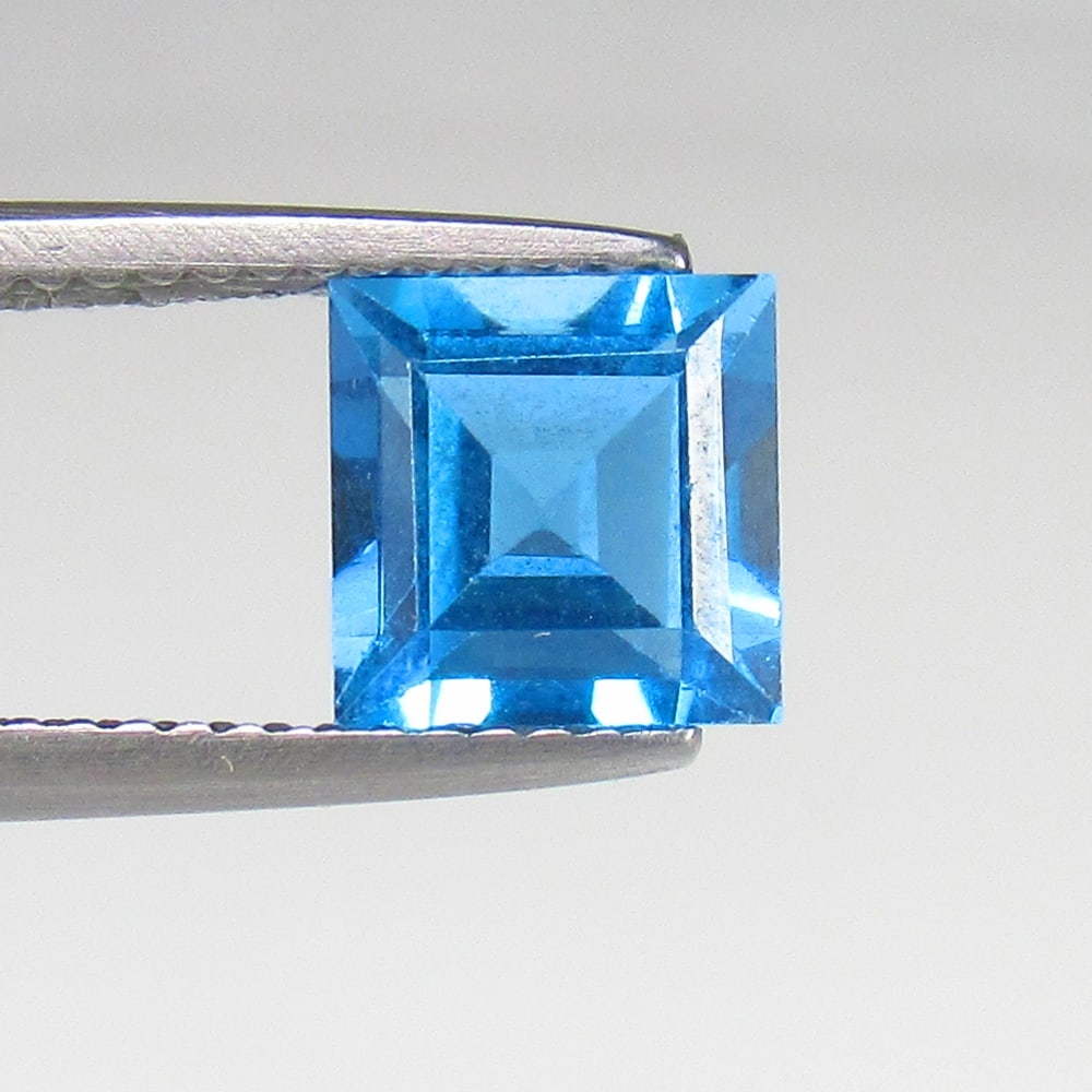 2.34 Ct Natural Blue Topaz Square Cut: Weight - 2.34 Ct / Size - 8.00 x 8.00 x 5.60 mm / Shape - Square Cut / Color - Blue / Clarity - VVS / Origin - Brazil / Treatment - Irradiated