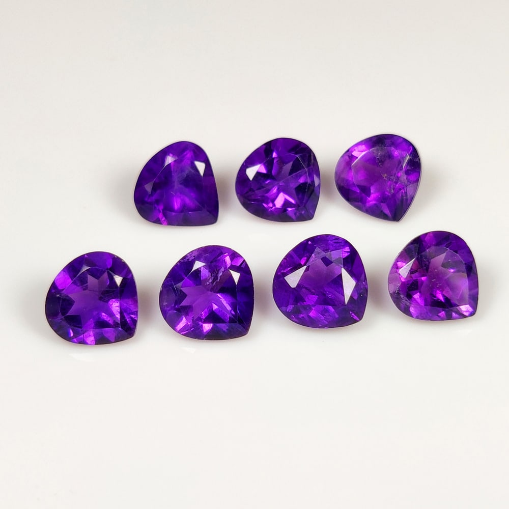 7.51 Ct Natural Purple Amethyst Pear Cut Necklace Set: Weight - 7.51 Ct / Size - 7.0x7.0 - 7.2x7.1 mm / 7 Pc's / Shape - Pear Cut / Color - Purple / Clarity - VVS / Origin - Brazil / Treatment - Heated