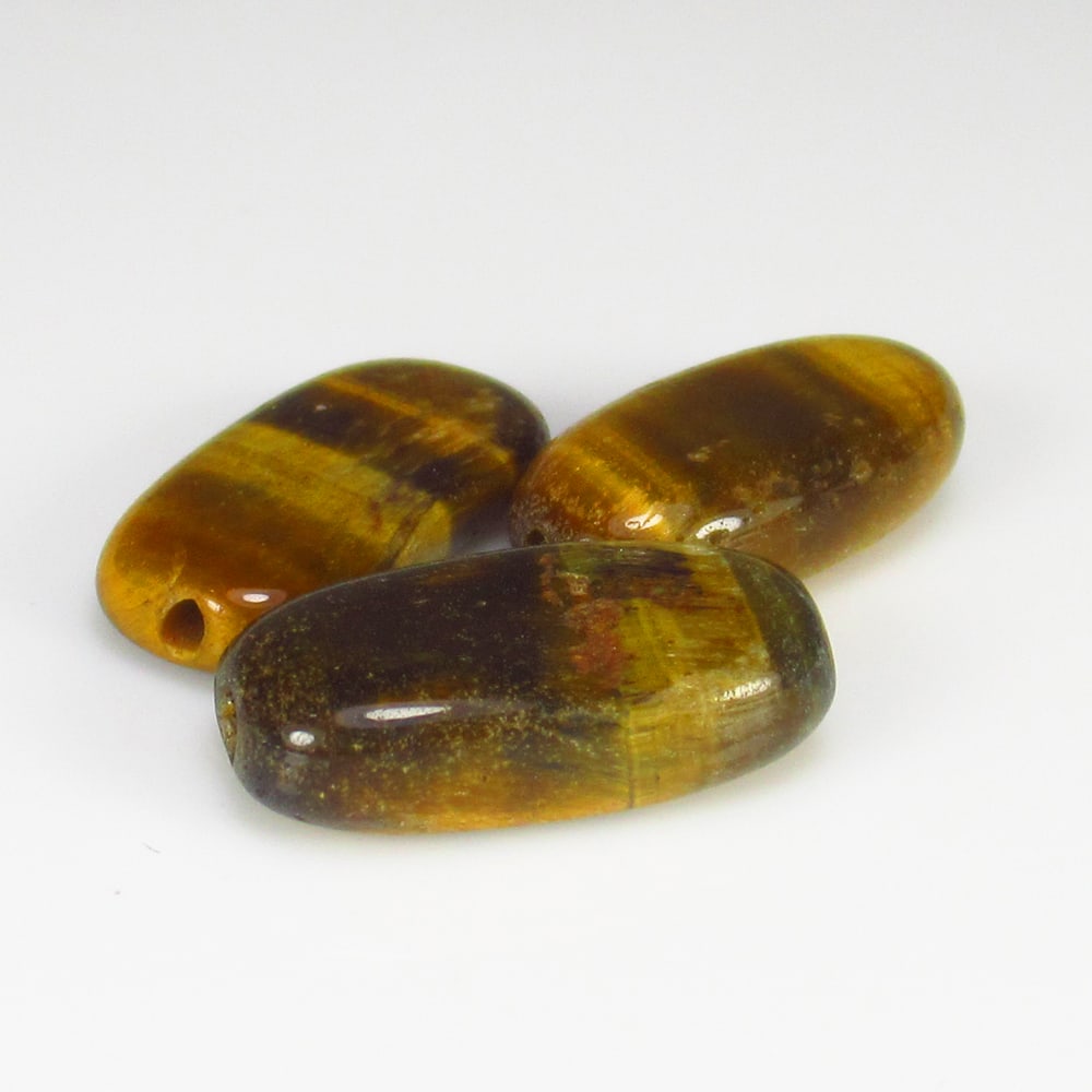 11.00 Ct Natural Tiger Eye Cushion Cab Set: Weight - 11.00 Ct / Size - 14.2x7.6 - 15.3x7.2 mm / 3 Pc's / Shape - Cushion Cab / Color - Golden Brown / Clarity - Opaque / Origin - Burma / Treatment - None