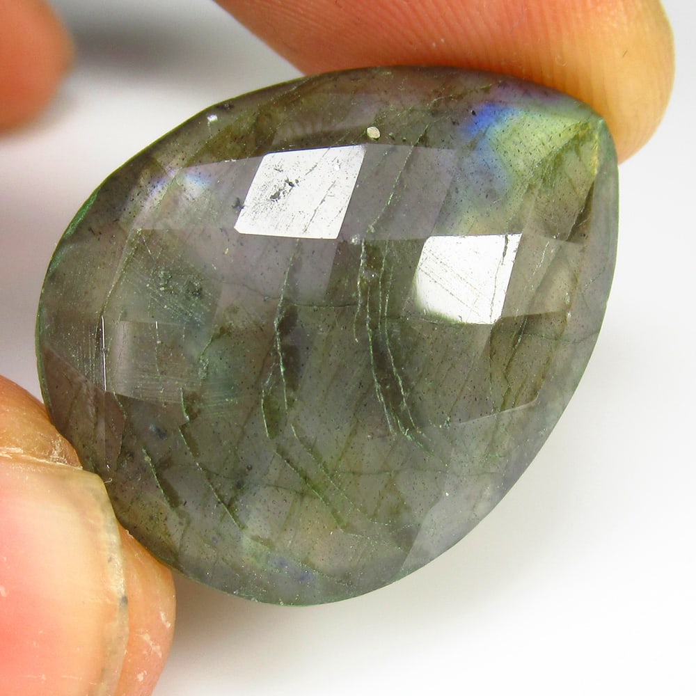 29.23 Ct Natural Labradorite Pear Cut: Weight - 29.23 Ct / Size - 29.00 x 20.70 x 8.10 mm / Shape - Excellent Pear Cut / Clarity - Opaque / Origin - Africa / Treatment - None
