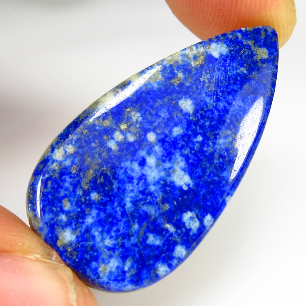 29.38 Ct Natural Blue Lapis Lazuli Pear Cab: Weight - 29.38 Ct / Size - 30.00 x 18.50 x 4.50 mm / Shape - Pear Cab / Clarity - Opaque / Origin - Afghanisthan / Treatment - None