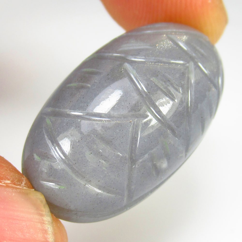 27.66 Ct Natural Moonstone Oval Carving Cab: Weight - 27.66 Ct / Size - 27.00 x 15.40 x 9.10 mm / Shape - Oval Carving Cabochon / Clarity - Opaque / Origin - India / Treatment - None