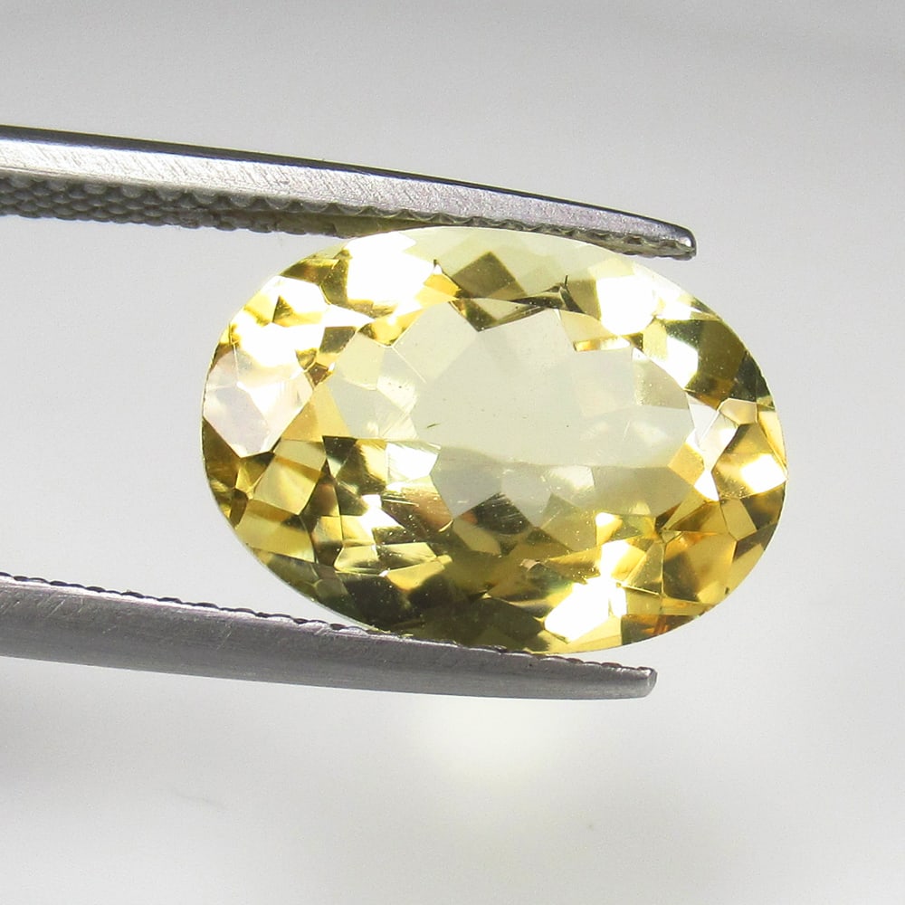 5.48 Ct Natural Yellow Citrine Oval Cut: Weight - 5.48 Ct / Size - 14.10 x 10.10 x 5.60 mm / Shape - Oval Cut / Color - Yellow / Clarity - VVS / Origin - Brazil / Treatment - Heated