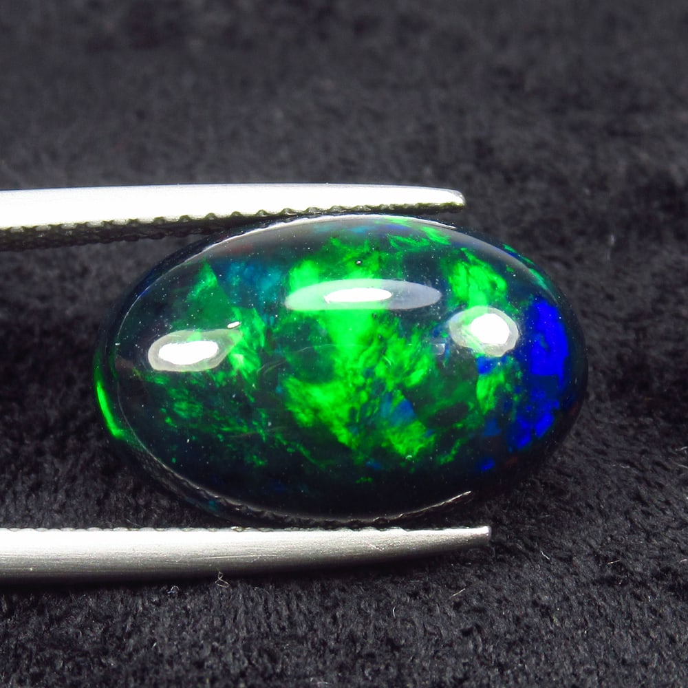 6.02 Ct Natural Black Flash Fire Opal Oval Cab (1 of 2)