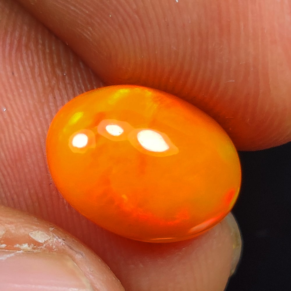 2.54 Ct Natural Orange Good Fire Opal Oval Cab: Weight - 2.54 Ct / Size - 12.50 x 9.40 x 5.00 mm / Shape - Oval Cab / Color - Orange / Clarity - Translucent / Origin - Ethiopia / Treatment - Heated