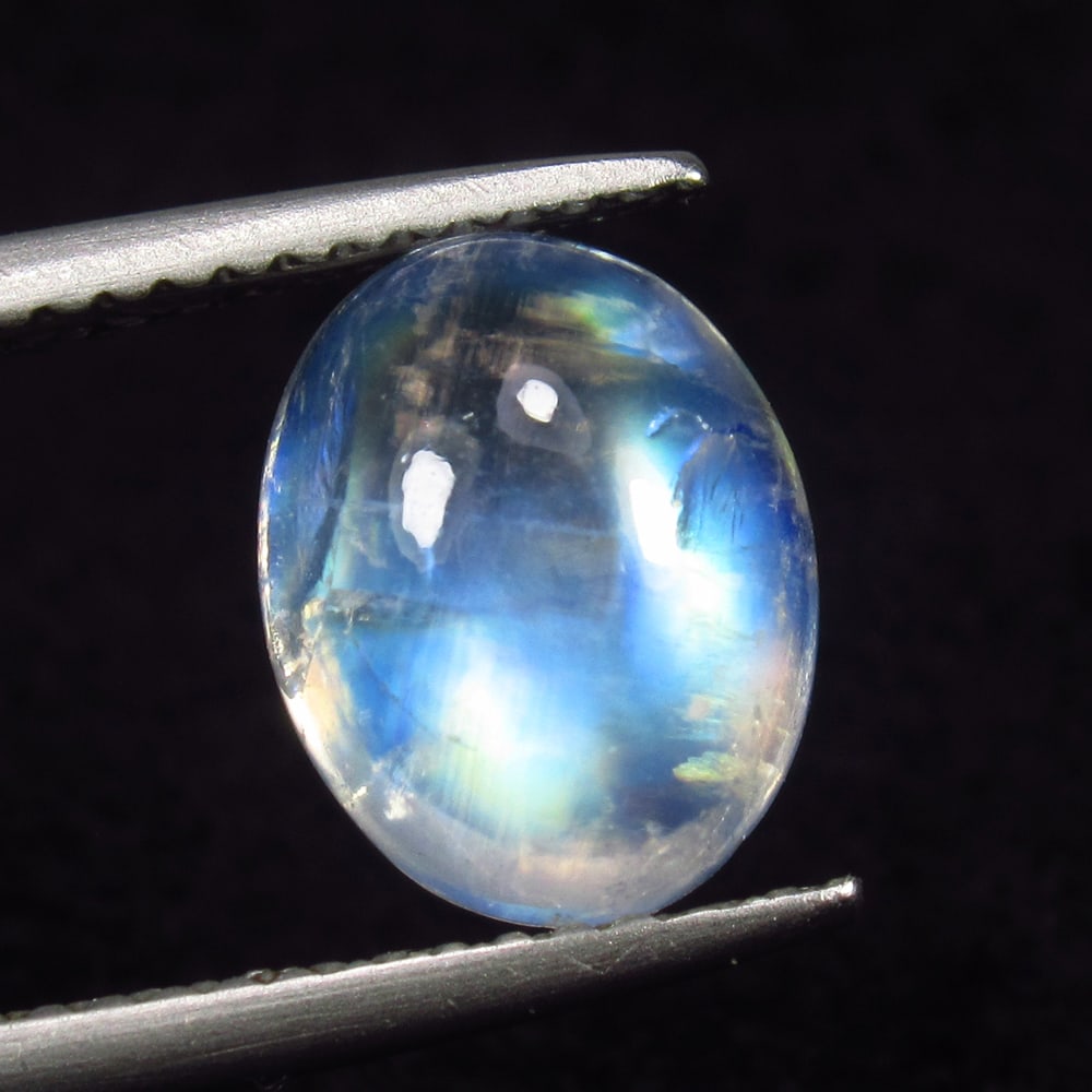 2.66 Ct Natural Blue Tint Moonstone Oval Cab: Weight - 2.66 Ct / Size - 10.10 x 8.20 x 4.90 mm / Shape - Oval Cab / Clarity - Semi-Transparent / Origin - India / Treatment - None