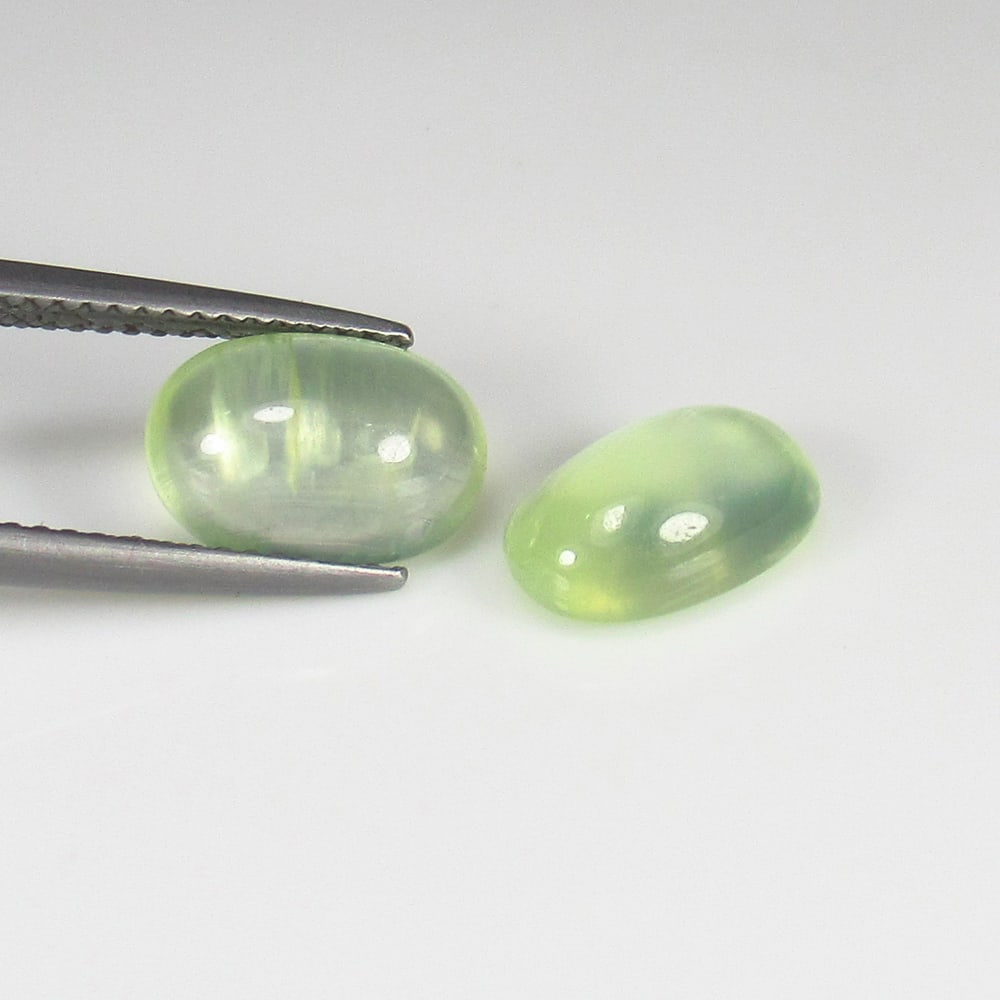 5.22 Ct Natural Fine Green Prehnite Oval Cab Pair: Weight - 5.22 Ct / Size - 11.90 x 7.70 x 5.00 mm / 2 Pc's / Shape - Oval Cab / Clarity - Semi Transparent / Origin - Brazil / Treatment - None