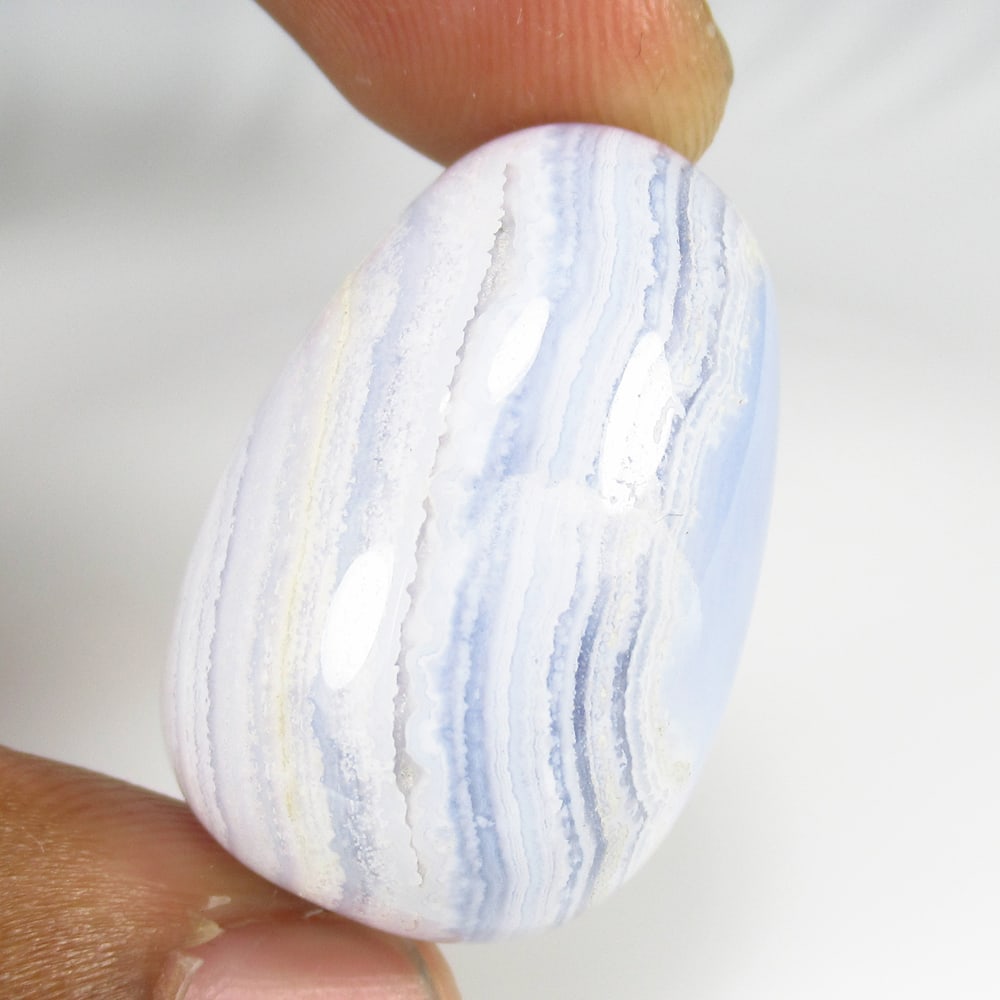 85.85 Ct Natural Blue Lace Agate Dumble Cab: Weight - 85.85 Ct / Size - 30.00 x 18.50 x 18.50 mm / Shape - Dumble Cab / Color - Blue / Clarity - Opaque / Origin -Brazil / Treatment - None