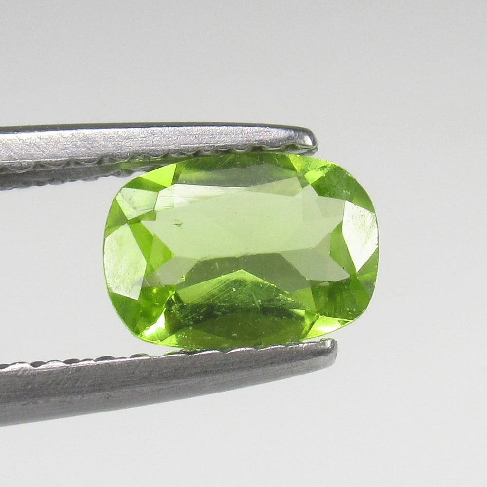 0.61 Ct Natural Green Peridot Cushion Cut: Weight - 0.61 Ct / Size - 7.00 x 5.00 x 2.50 mm / Shape - Cushion Cut / Color - Green / Clarity - VVS / Origin - Pakistan / Treatment - None