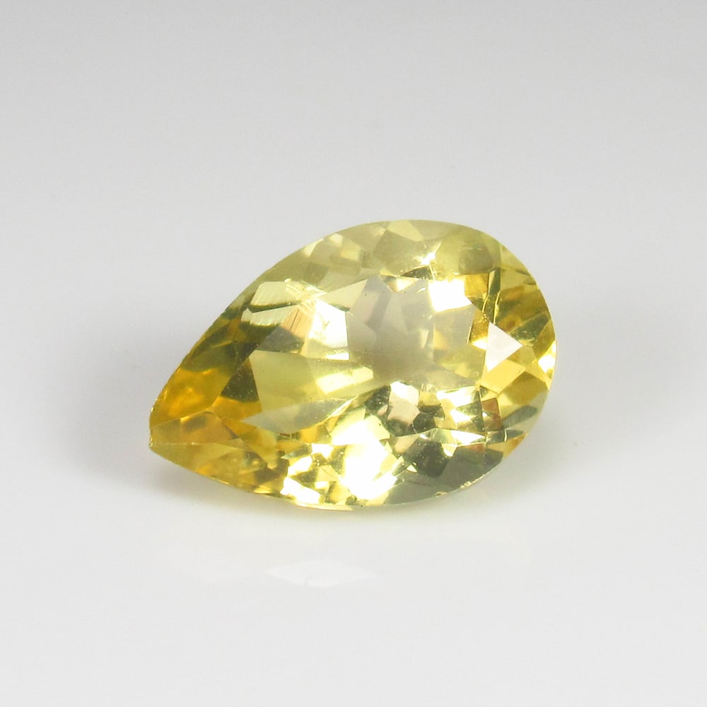 4.97 Ct Natural Citrine Pear Cut: Weight : 4.97 Ct / Dimensions - : 14.6 x 10.0 x 7.0 mm/ Shape : Pear Faceted / Color : Orangish Yellow / Transparency : Transparent / Treatment : Heated