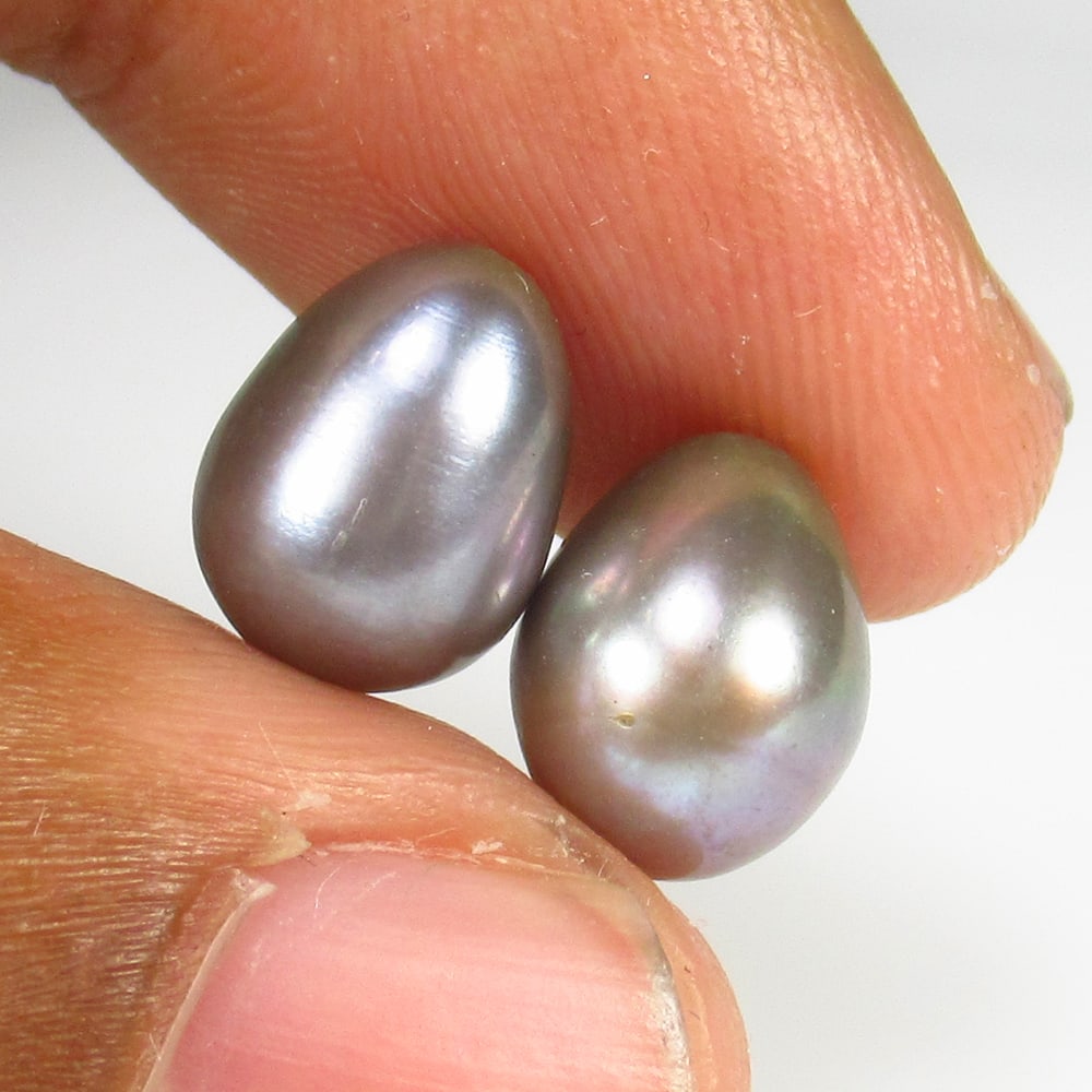 9.32 Ct Natural Dahitan Pearl Egg Shaped Beads: Weight - 9.32 Ct / Size - 16.40 x 8.00 x 8.00 mm / 2 Pc's / Shape - Drilled Egg Shaped Beads / Clarity - Opaque / Origin - Tahiti / Treatment - None