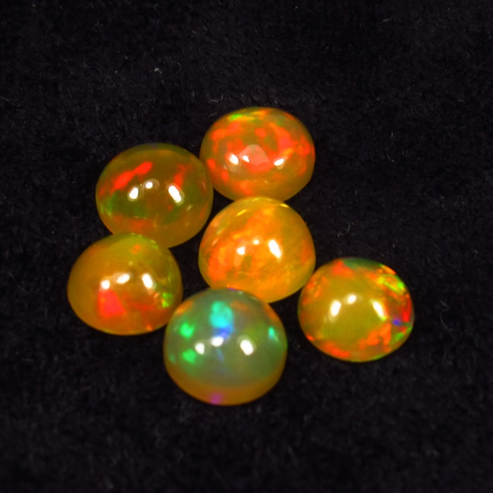 2.11 Ct Natural Multicolor Top Fire Opal Round Cab Set: Weight - 2.11 Ct / Size - 5.00 x 5.00 x 2.80 mm / 2 Pc's / Shape - Round Cab / Color - Multicolor / Clarity - Translucent / Origin - Ethiopia / Treatment - None