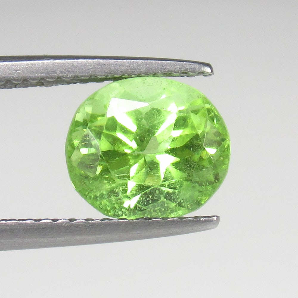 2.44 Ct Natural Green Peridot Oval Cut: Weight - 2.44 Ct / Size - 9.40 x 8.50 x 6.20 mm / Shape - Oval Cut / Color - Green / Clarity - VVS / Origin - Pakistan / Treatment - None