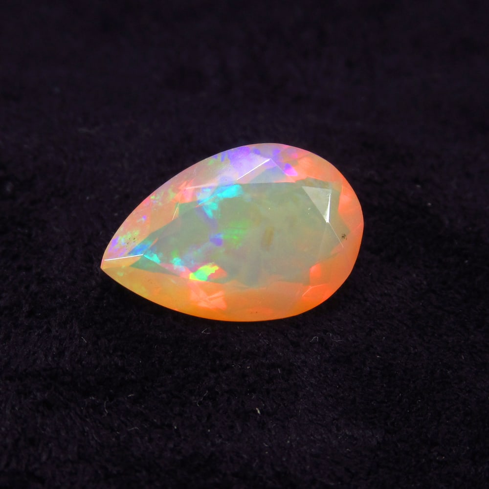 4.01 Ct Natural Multicolor Welo Opal Top Fire Pear Cut: Weight - 4.01 Ct / Size - 15.20 x 10.00 x 6.70 mm / Shape - Pear Cut / Color - Multicolor / Clarity - Translucent / Origin - Ethiopia / Treatment - None
