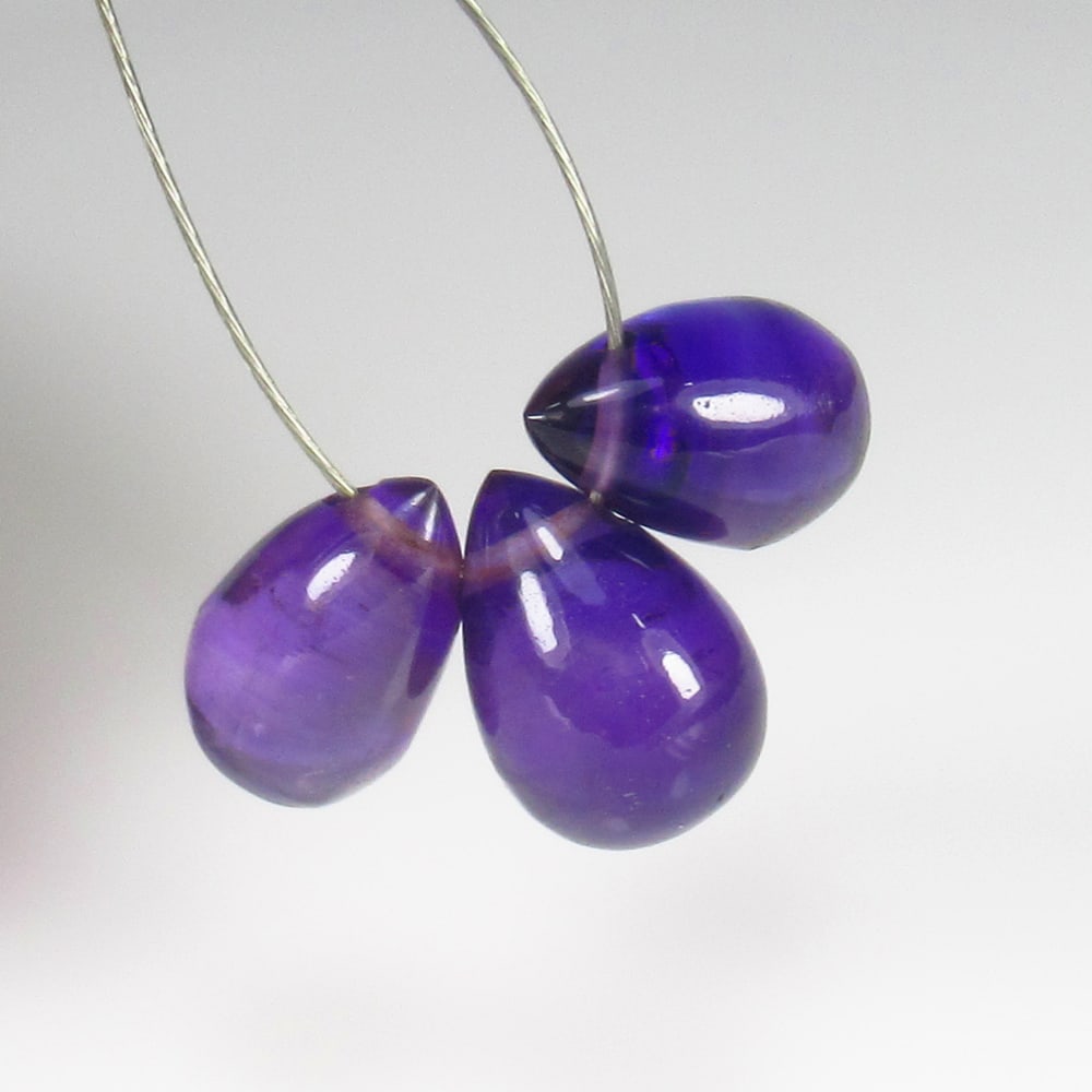 5.00 Ct Natural Purple Amethyst Pear Drop Beads: Weight - 5.00 Ct / Size - 8.4x5.2 - 8.7x6.2 mm / 3 Pc's / Shape - Pear Drop Beads / Color - Purple / Clarity - VVS / Origin - Brazil / Treatment - Heated