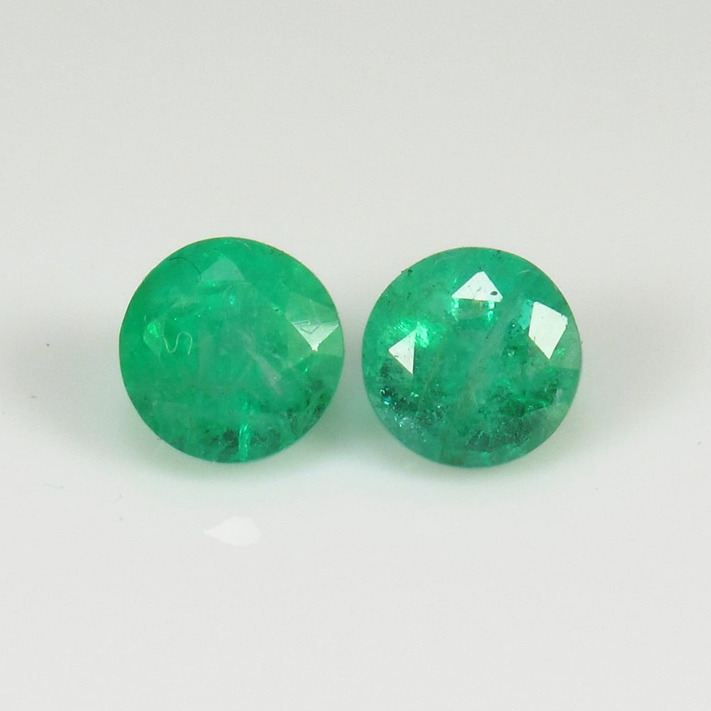 0.89 Ct Natural Zambian Emerald Round Cut Pair: Weight - 0.89 Ct / Size - 4.60 x 4.60 x 3.60 mm / 2 Pc's / Shape - Round Cut / Color - Green / Clarity - SI / Origin - Zambia / Treatment - Natural Emeralds are commonly enhanced by oil