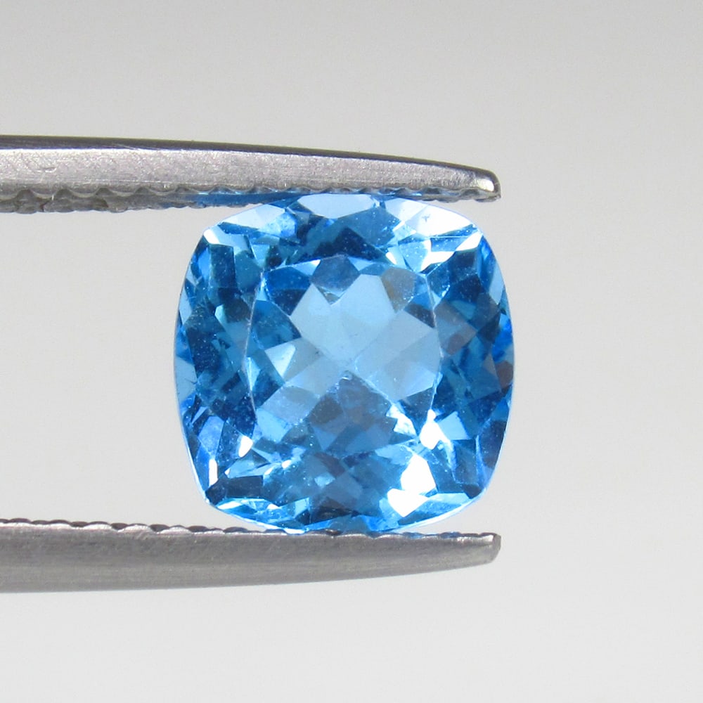 2.43 Ct Natural Blue Topaz Cushion Cut: Weight - 2.43 Ct / Size - 8.50 x 8.50 x 6.20 mm / Shape - Cushion Cut / Color - Blue / Clarity - VVS / Origin - Brazil / Treatment - Irradiated