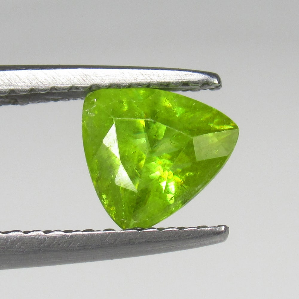 1.06 Ct Natural Sphene Trillion Cut: Weight - 1.06 Ct / Size - 6.50 x 6.50 x 4.50 mm / Shape - Trillion Cut / Color - Greenish Yellow / Clarity - SI / Origin - Myanmar / Treatment - None