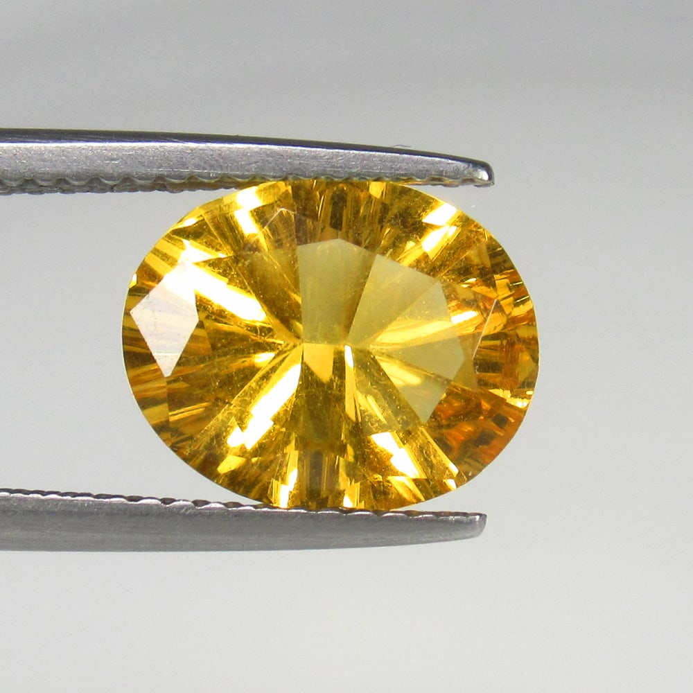 2.45 Ct Natural Yellow Citrine Oval Concave Cut: Weight - 2.45 Ct / Size - 11.00 x 8.90 mm / Shape - Oval Concave Cut / Color - Yellow / Clarity - VVS / Origin - Brazil / Treatment - Heated