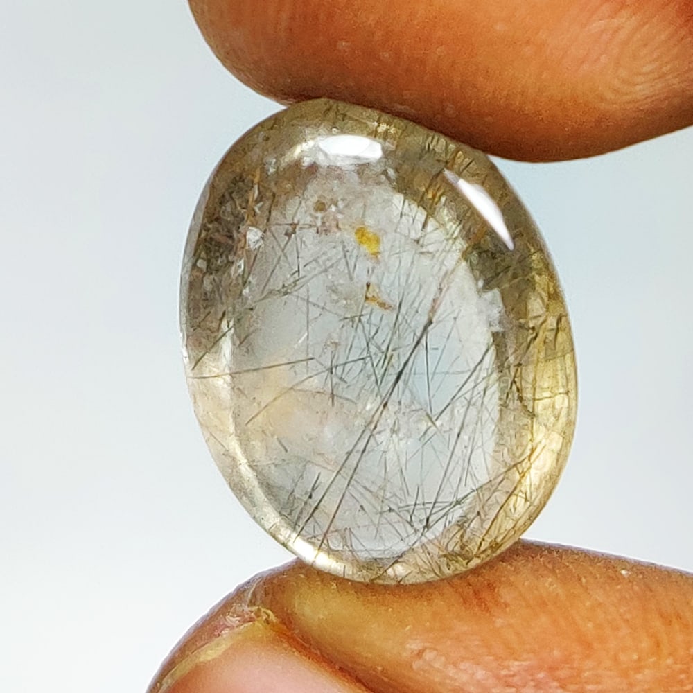 10.98 Ct Natural Rutile Quartz Oval Cab: Weight - 10.98 Ct / Dimensions - 17.40 x 13.30 x 7.00 mm / Shape - Oval Cab / Clarity - Transparent / Origin - Norway / Treatment - None