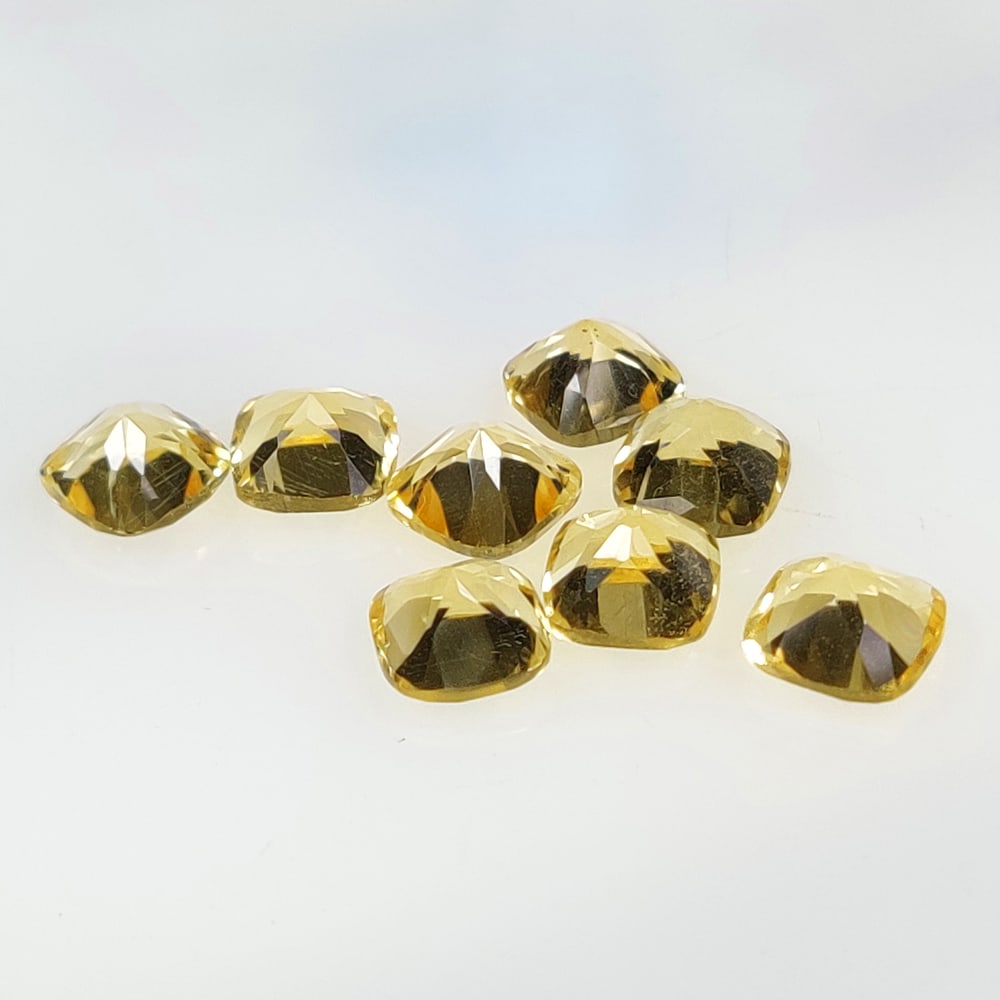 7.61 Ct Natural Yellow Citrine Top Luster Cushion Set: Weight - 7.61 Ct / Dimensions - 6.10 x 4.20 - 6.10 x 4.40 mm / 8 Pc's / Shape - Cushion Cut / Color - Yellow / Clarity - VVS / Origin - Brazil / Treatment - Heated